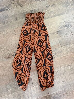Anthropologie Strapless Smocked Wide-Leg Jumpsuit in Orange and Black